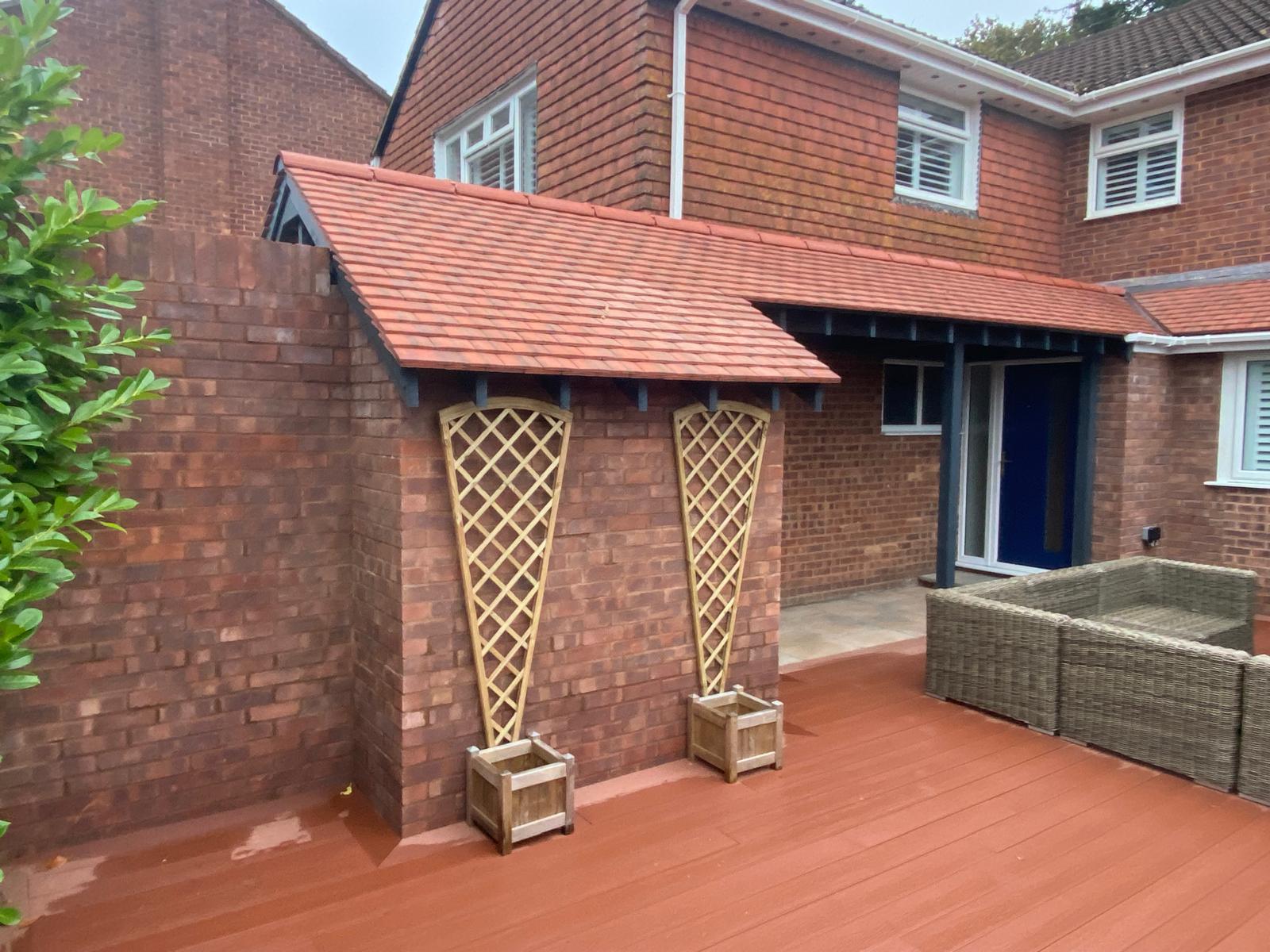 Completed brick house extension with tiled terrace